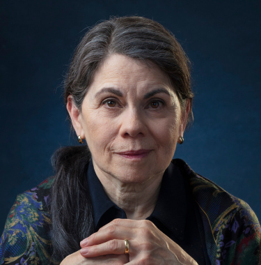 An image depicting a middle aged woman living with Alzheimer's disease